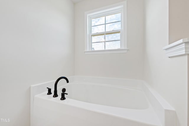 bathroom featuring a tub