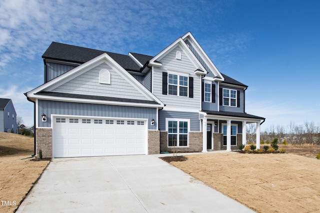 craftsman house featuring a garage and covered porch