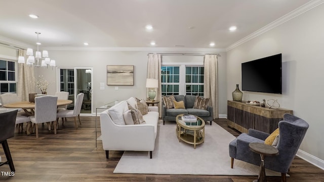 living room with ornamental molding, dark hardwood / wood-style floors, and a chandelier