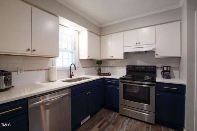 kitchen featuring blue cabinets, sink, ornamental molding, stainless steel appliances, and white cabinets