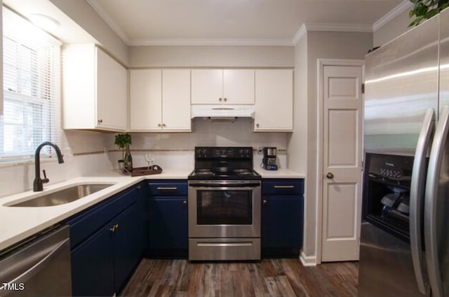 kitchen with blue cabinets, sink, white cabinets, stainless steel appliances, and crown molding