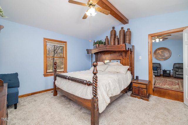 carpeted bedroom featuring lofted ceiling with beams and ceiling fan