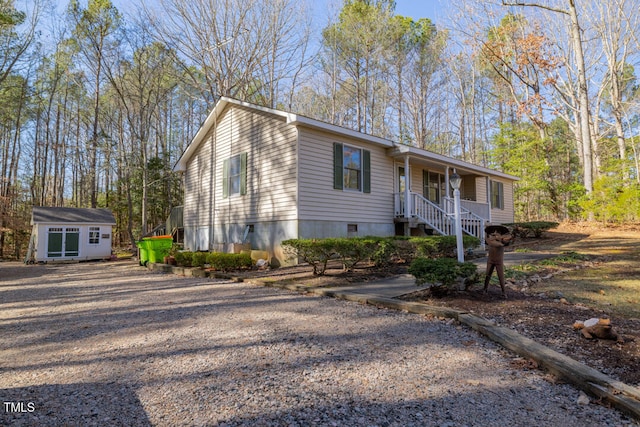 view of front of house featuring a shed