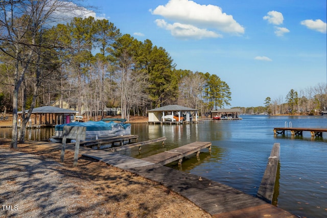 view of dock featuring a water view and a gazebo