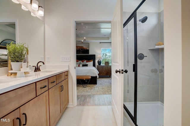 bathroom with vanity, tile patterned floors, and a shower with shower door