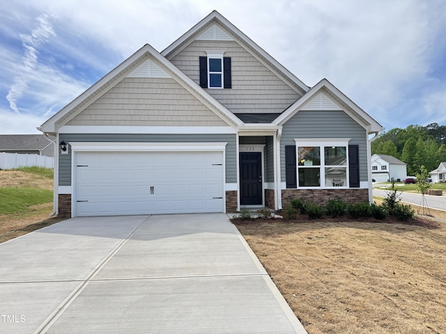 142 Vega Loop, Sanford, NC 27330 - craftsman inspired home with stone siding, concrete driveway, a front lawn, and an attached garage