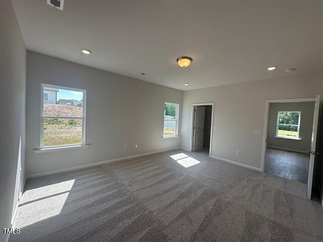 142 Vega Loop, Sanford, NC 27330 - unfurnished bedroom with multiple windows, carpet, baseboards, and recessed lighting