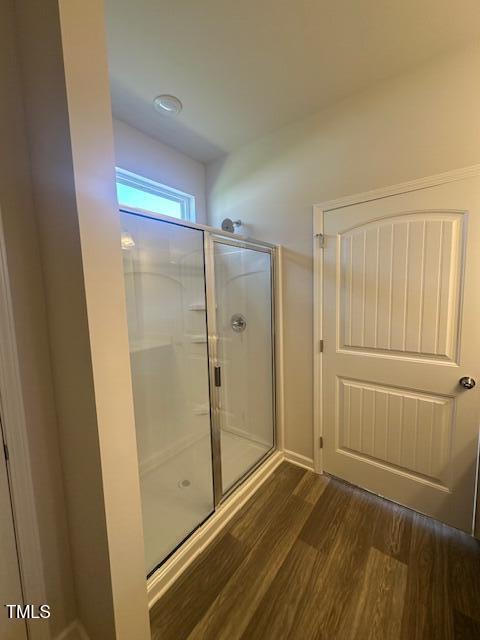 142 Vega Loop, Sanford, NC 27330 - bathroom featuring a stall shower and wood finished floors