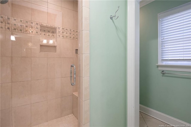 bathroom with tile patterned flooring and a shower with door