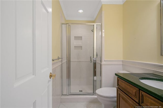 bathroom with crown molding, vanity, toilet, and an enclosed shower