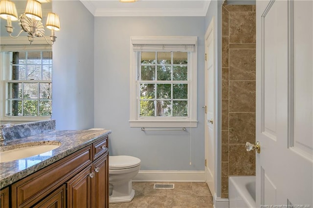 bathroom with ornamental molding, vanity, an inviting chandelier, and toilet