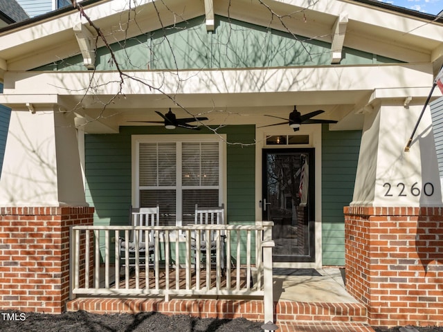 entrance to property with a porch and ceiling fan