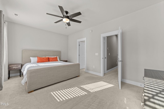 bedroom featuring ceiling fan and light colored carpet