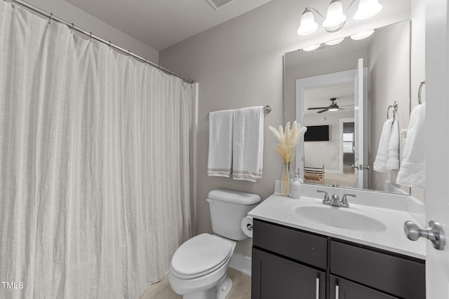 bathroom with vanity, tile patterned floors, and toilet