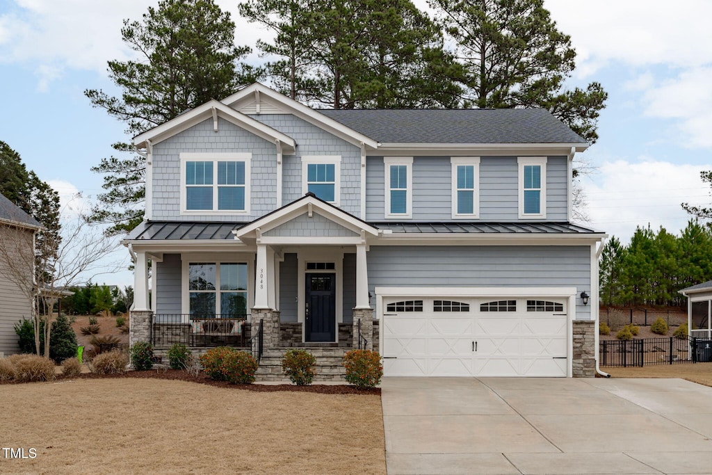 craftsman house featuring a garage and a porch