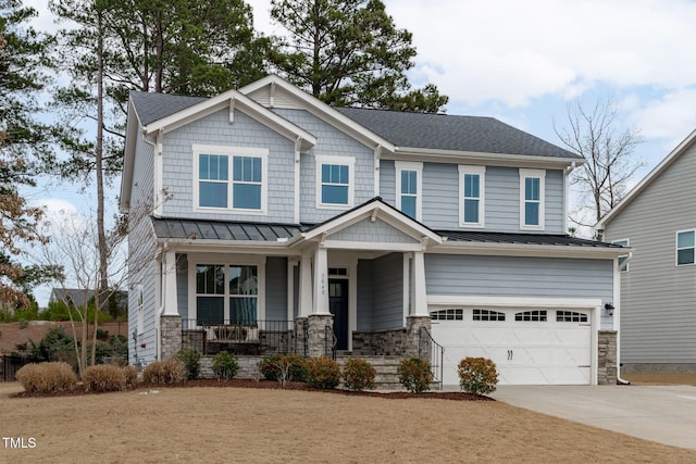 craftsman house with a garage and a porch