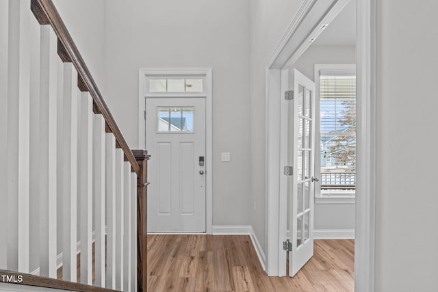 foyer with light hardwood / wood-style floors