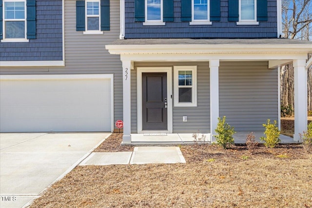 view of exterior entry featuring a garage