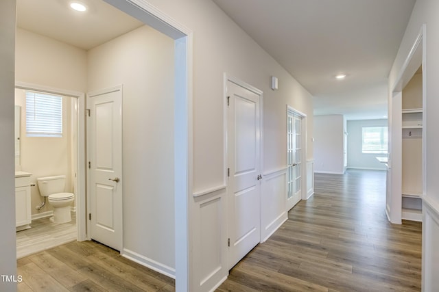 hall with light hardwood / wood-style flooring