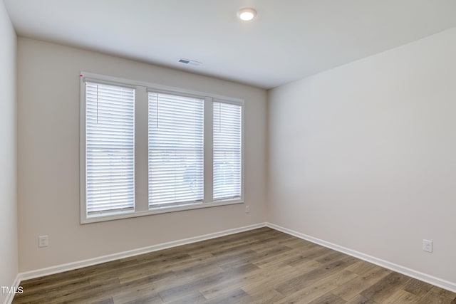 empty room featuring hardwood / wood-style floors