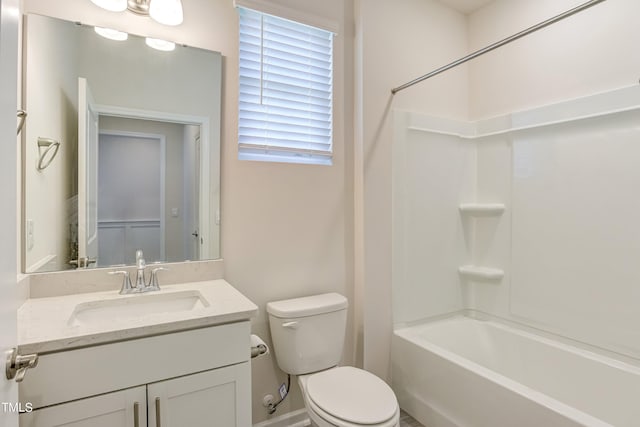 full bathroom featuring vanity, bathtub / shower combination, and toilet