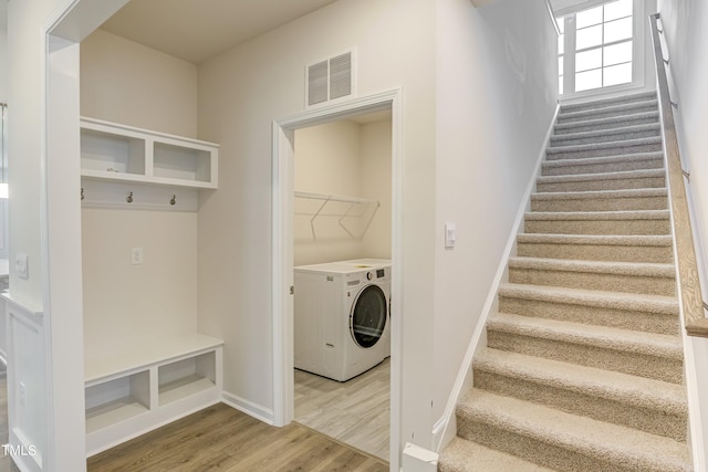 mudroom featuring washer / clothes dryer and hardwood / wood-style floors