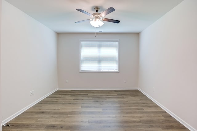 unfurnished room featuring hardwood / wood-style flooring and ceiling fan