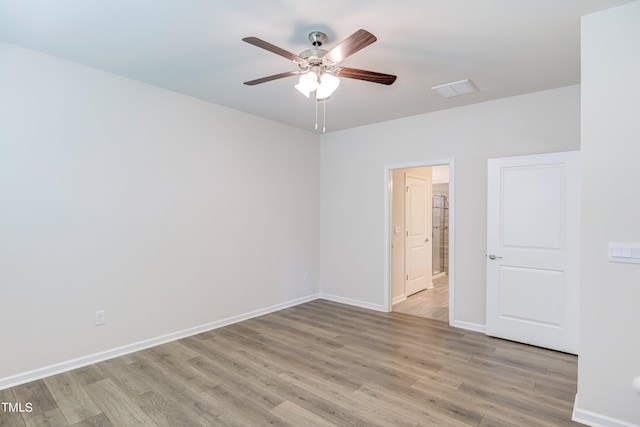 unfurnished room with ceiling fan and light hardwood / wood-style floors