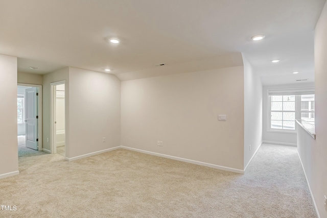 empty room featuring light colored carpet