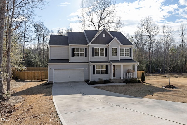 view of property featuring a garage and a porch