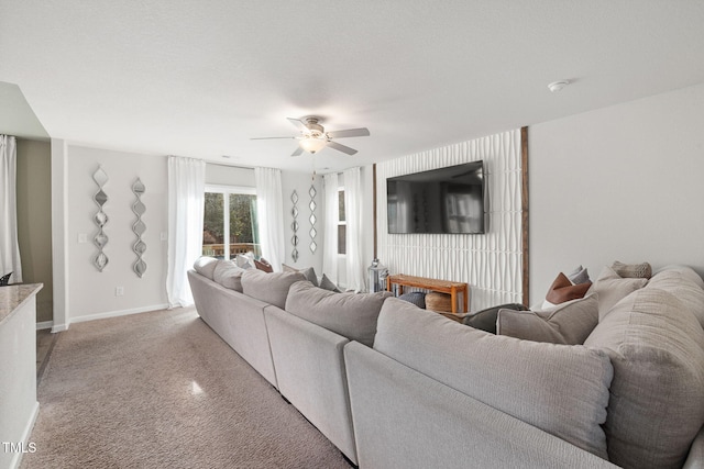 living room with light carpet and ceiling fan