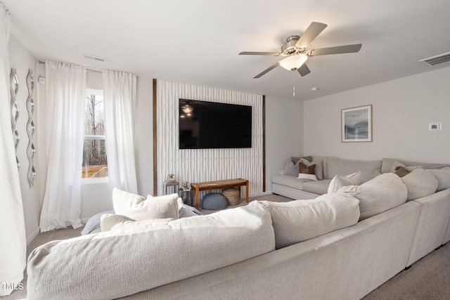 living room with light colored carpet and ceiling fan