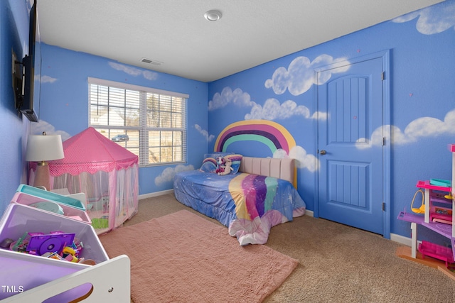 carpeted bedroom with a textured ceiling