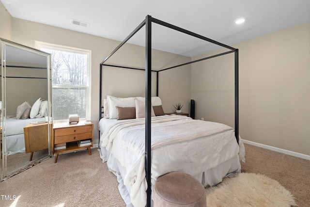 bedroom with light colored carpet