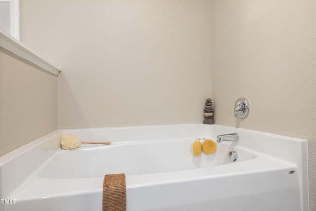 bathroom with a washtub