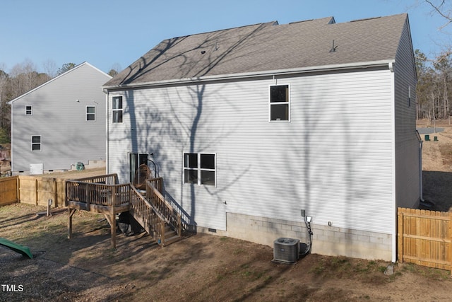 back of property featuring central AC and a deck