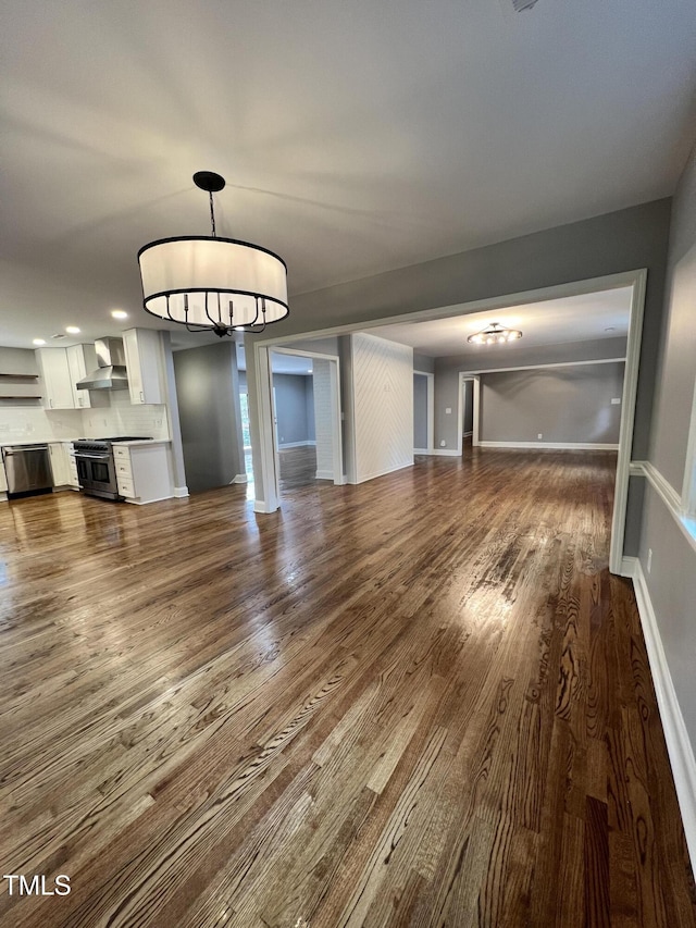 unfurnished living room featuring dark hardwood / wood-style floors