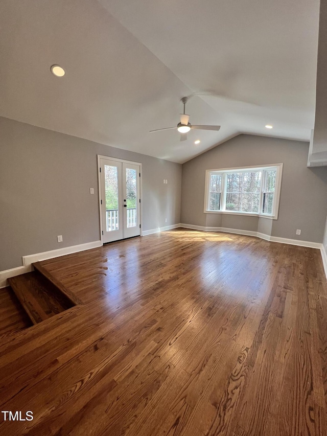 unfurnished living room with hardwood / wood-style flooring, french doors, and a healthy amount of sunlight