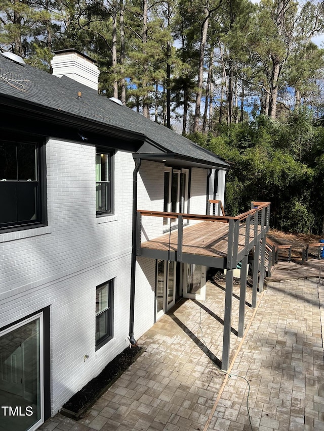 view of property exterior with a patio