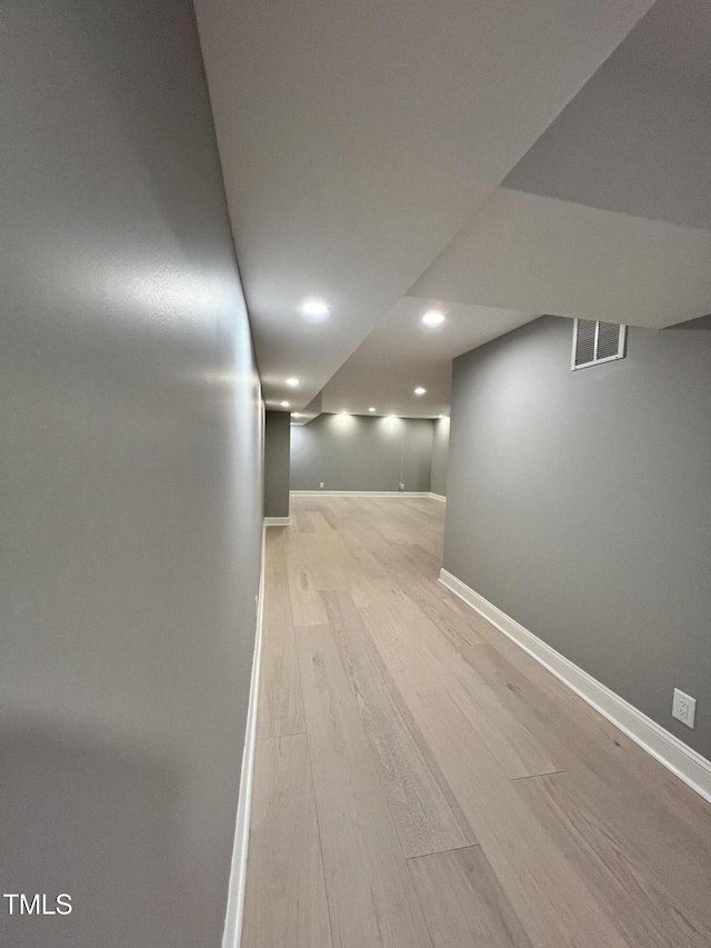 corridor featuring light wood-type flooring