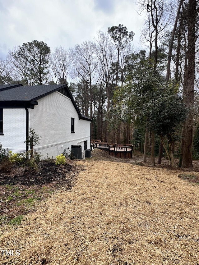 view of yard with central AC unit