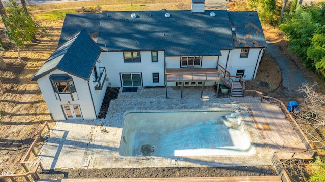 rear view of property with a patio area, a deck, and french doors