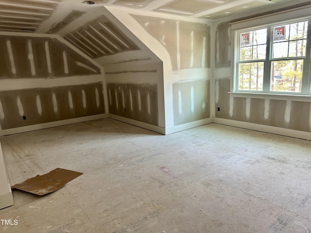 additional living space with vaulted ceiling