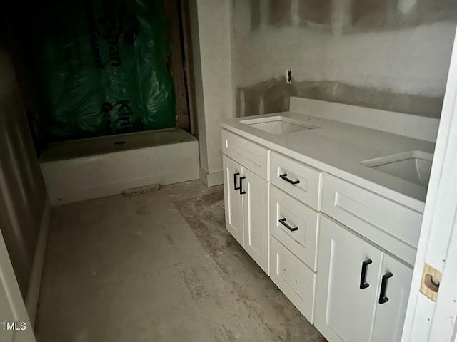 bathroom featuring vanity and a bathtub