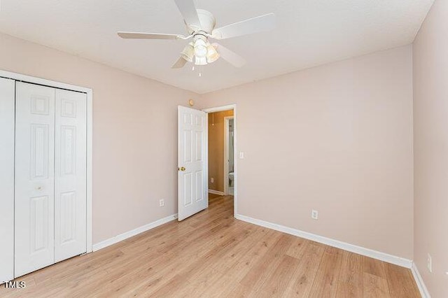 unfurnished bedroom with a closet, ceiling fan, and light wood-type flooring