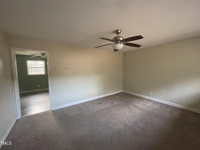 empty room featuring ceiling fan and carpet flooring