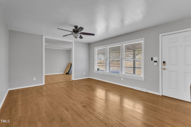 interior space with ceiling fan and light wood-type flooring