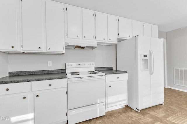 kitchen featuring white cabinetry and white appliances