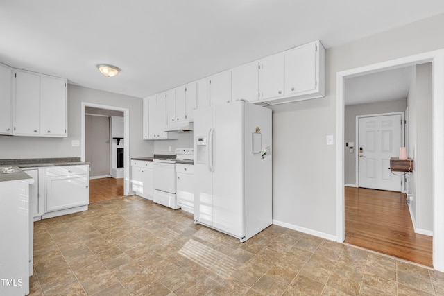 kitchen with white cabinetry and white appliances