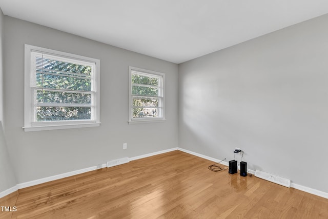 spare room featuring light hardwood / wood-style floors